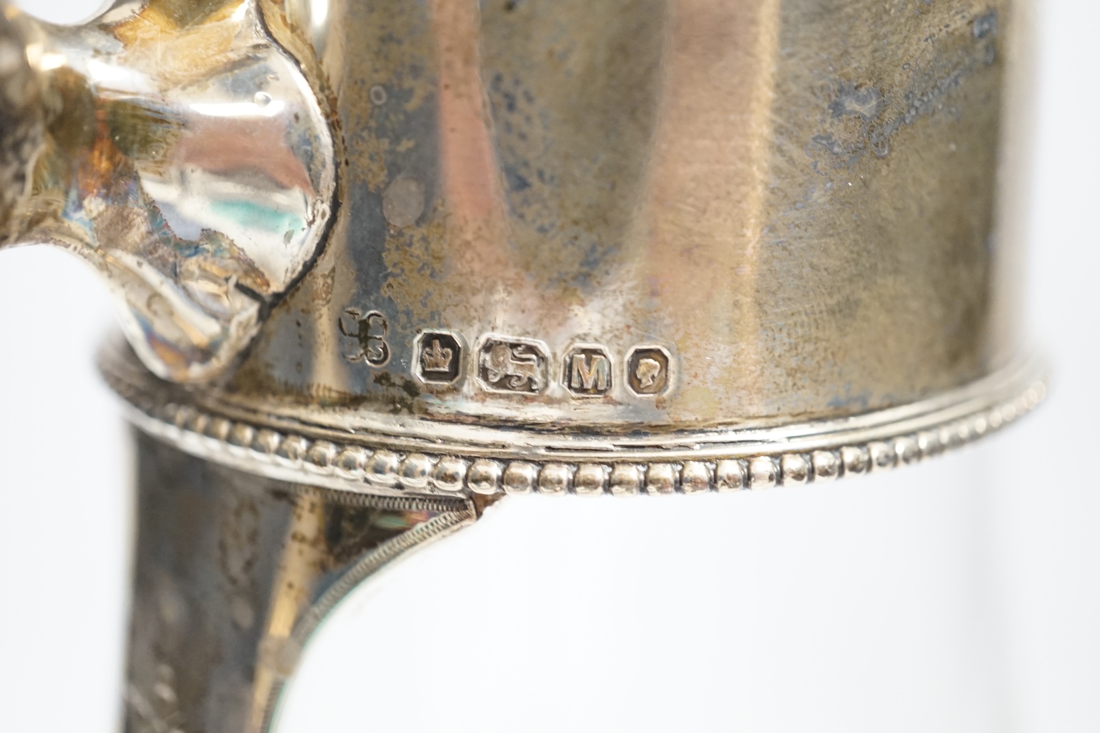 A Victorian silver mounted glass claret jug, W & G Sissons, Sheffield, 1879, 27.4cm, together with three mounted glass bottles, two with French white metal mounts.